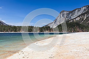 An alpine, freshwater lake Tovel, surrounded by forested mountains,Â Ville Anaunia, Trentino, Italy